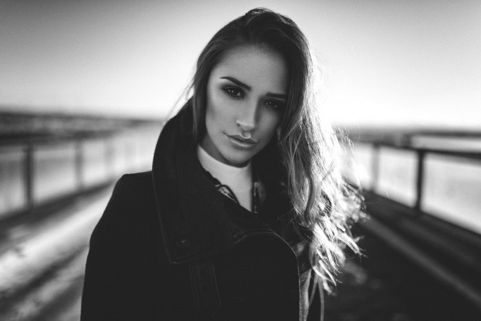 Woman in black coat, black and white portrait