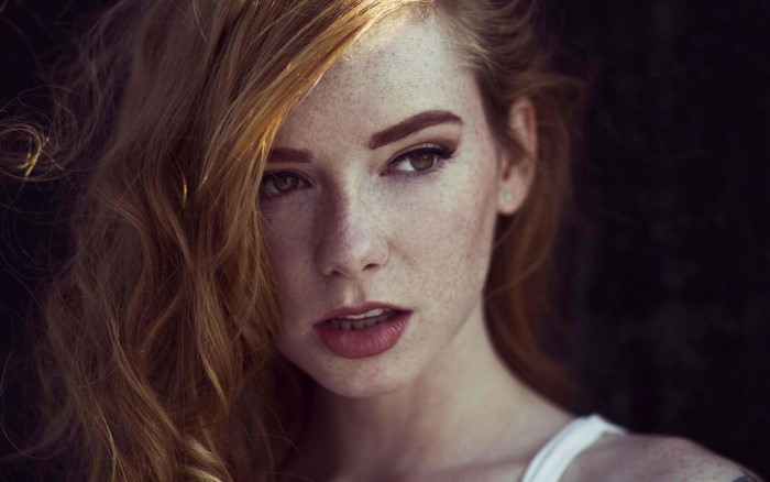 Woman with freckles and red hair portrait