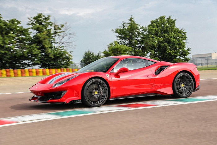 Red Ferrari 488 Pista on a race track