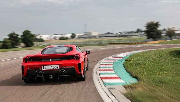Red 2019 Ferrari 488 Pista on a race track