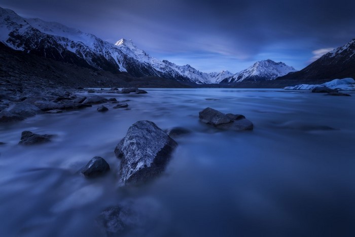 Blue Hour Landscape of Snowy Mountains and Lake