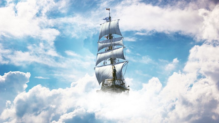 A sailing ship navigates through the clouds