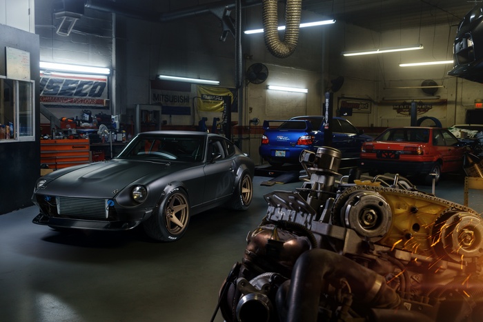 Nissan S30 in a garage with engine parts