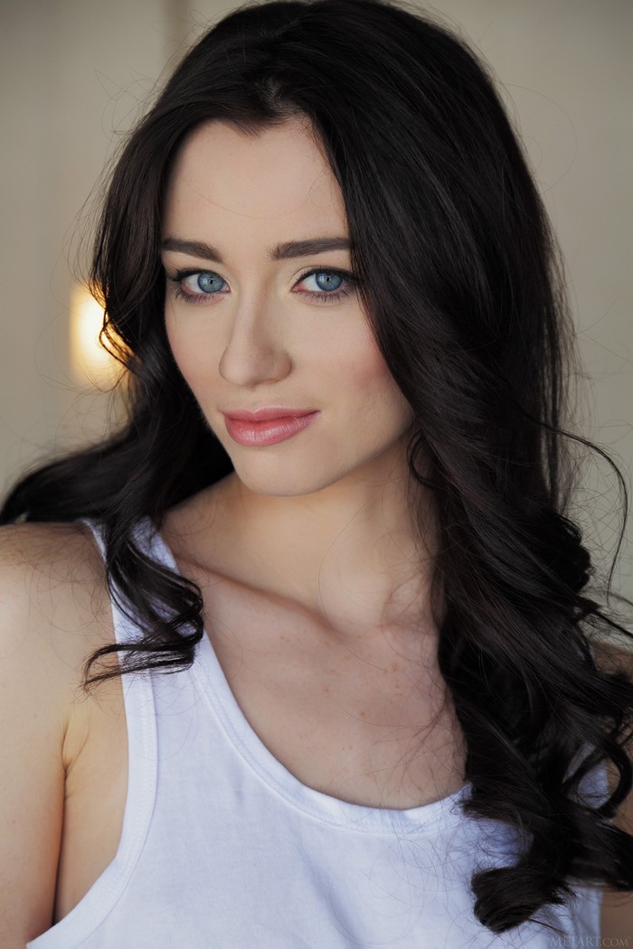 Portrait of a Woman with Blue Eyes and Black Hair
