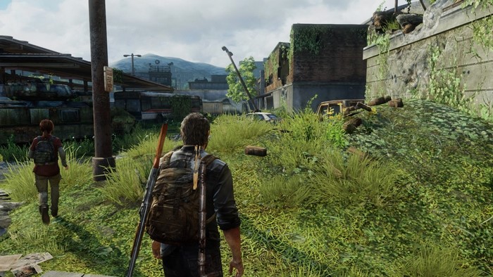 Joel and Ellie from The Last of Us in a ruined village