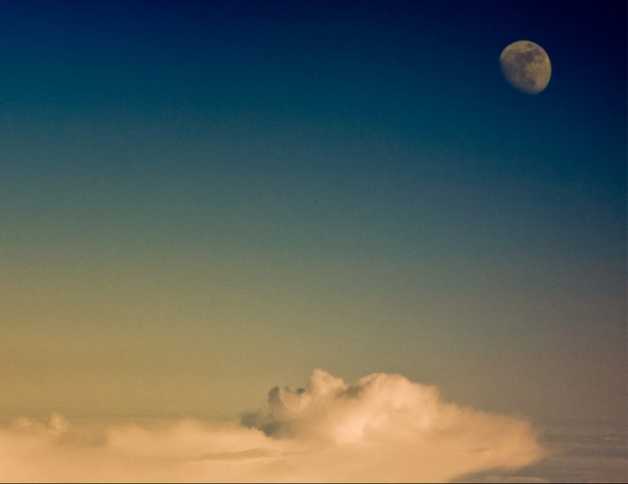 Moon and clouds in the sky at dawn
