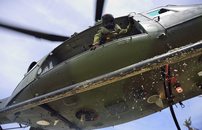 Canadian military helicopter pilot in flight