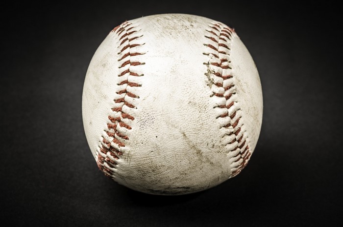 Close up of a worn baseball