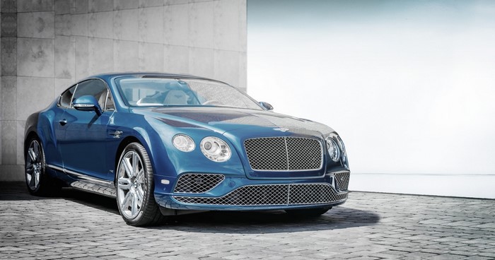 Blue Bentley Continental GT parked on cobblestone