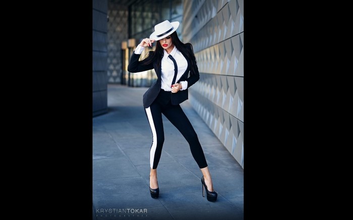 Woman in a suit and hat by Krystian Tokar