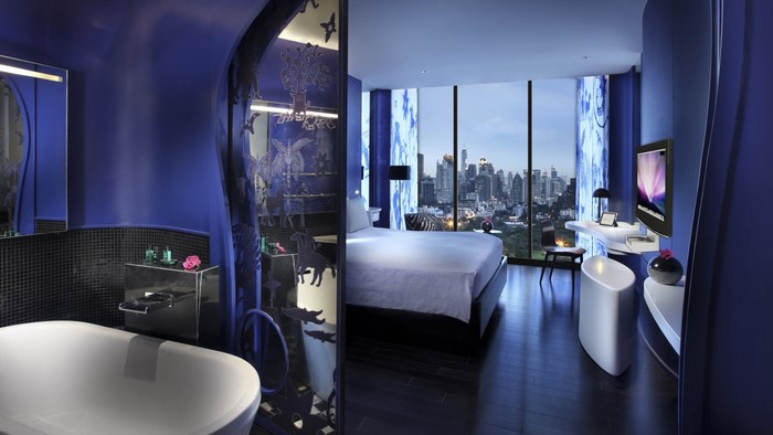 Modern hotel suite with bathtub and cityscape view in Bangkok
