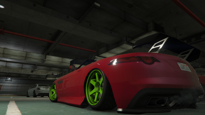 Red sports car with spoiler in Grand Theft Auto V