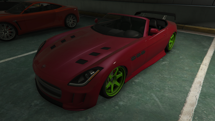 Red sports car with green wheels in a parking lot