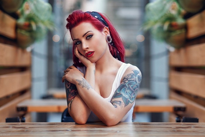 Woman with red hair and tattoos by Alessandro Di Cicco
