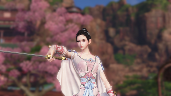 Woman in traditional Chinese dress holding a sword