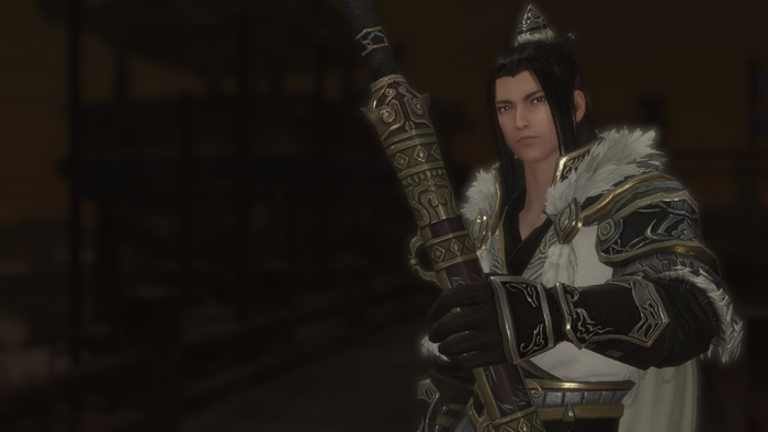 Man in WuXia armor holding a weapon