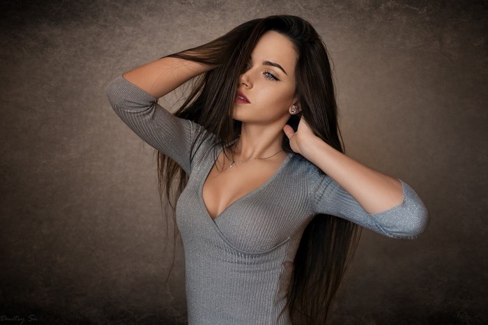 Elegant Woman with Flowing Long Hair Posing Gracefully