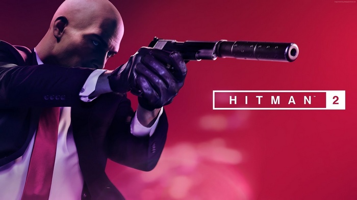 Agent 47 from Hitman 2 holding a silenced pistol