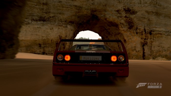Ferrari F40 driving through a canyon in Forza Horizon 3