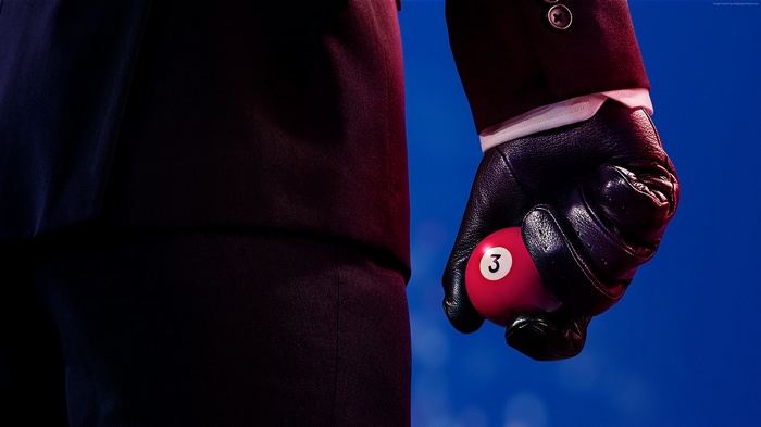 Agent 47 from Hitman 2 holding a pool ball