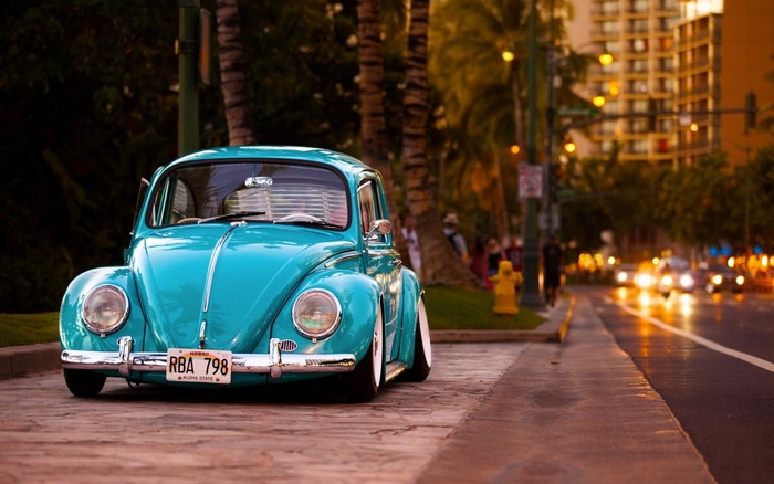 Blue Volkswagen Beetle lowrider on a street in Hawaii