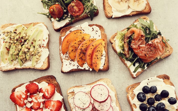 Assortment of open-faced sandwiches with various toppings