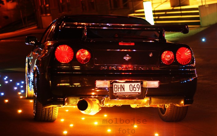 Nissan Skyline GT-R R34 rear view at night