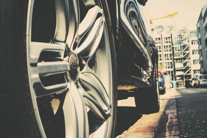 Audi car wheel on a city street