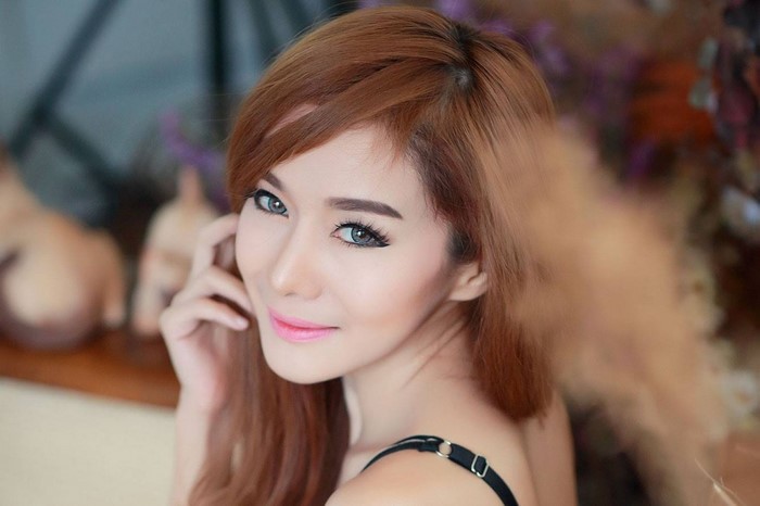 Portrait of a Smiling Asian Woman with Long Hair