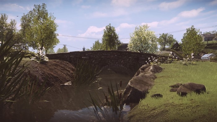 Stone bridge over a stream in a rural landscape