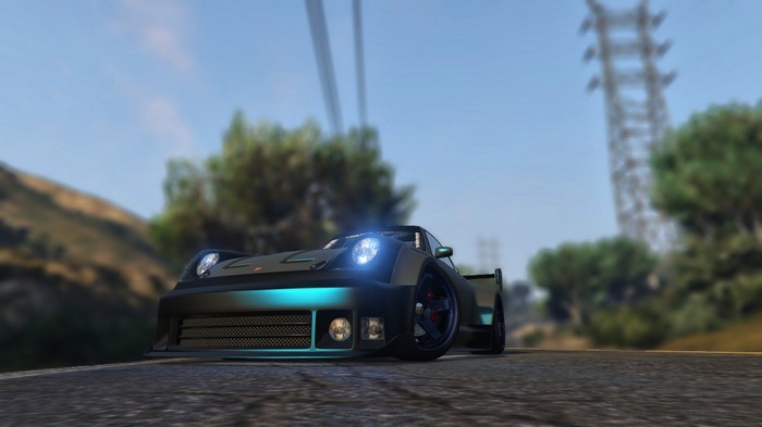 Sports car with blue underglow on a road