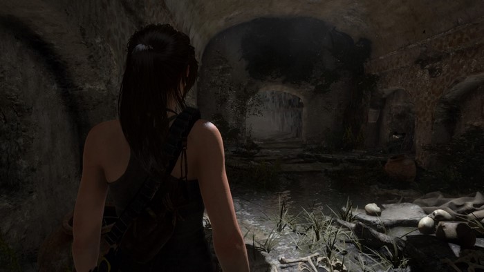 Lara Croft in a dark ancient tomb