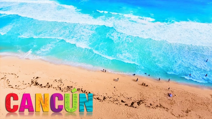 Cancun beach with turquoise ocean waves and sandy shore