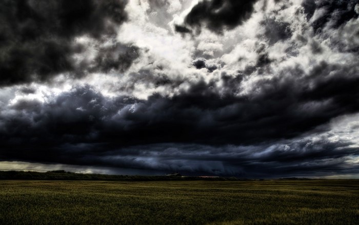 Dark storm clouds over a field