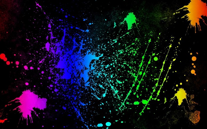Colorful paint splatters on a black background