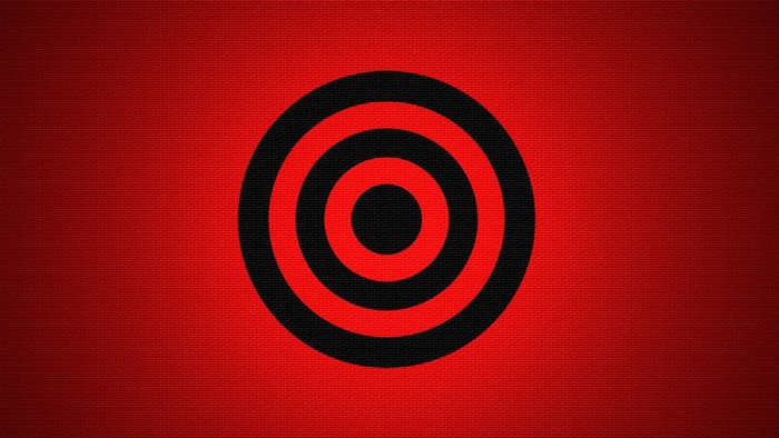 Red and black concentric circles on red textured background