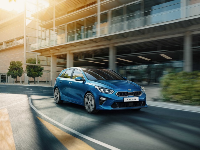 Blue 2019 Kia Ceed driving on a city street