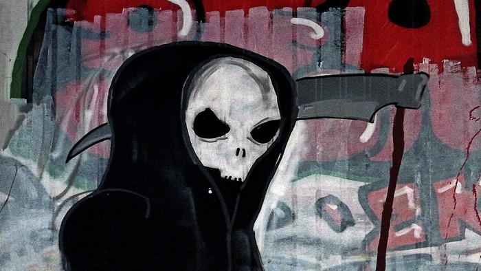 Graffiti painting of the Grim Reaper with a scythe