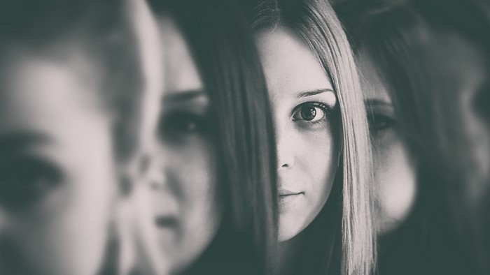 Monochrome portrait of a woman with multiple reflections