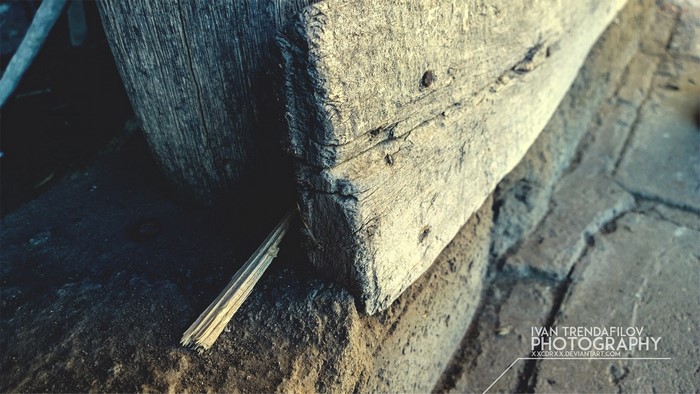 Close-up of weathered wood and stone texture