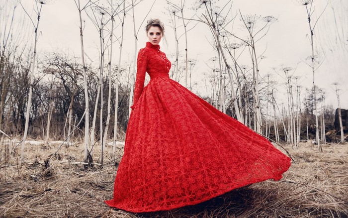 Woman in Elegant Red Lace Dress Outdoors