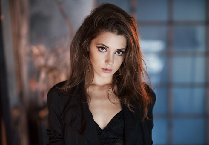 Portrait of Woman with Auburn Hair and Intense Eyes