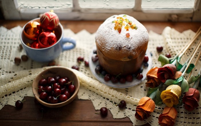 Panettone cake with cherries and Christmas ornaments