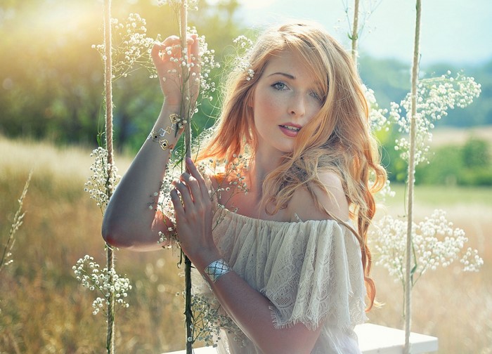Sunlit Portrait of a Woman with Long Red Hair