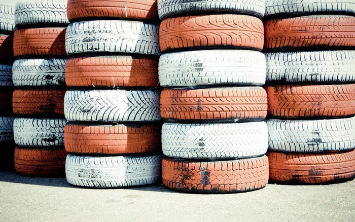Stacks of orange and white tires