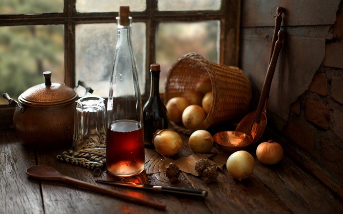 Still life painting of food and kitchenware by a window