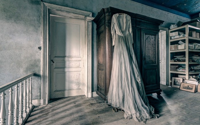 Abandoned room with a dress and wardrobe