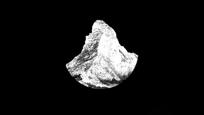 Monochrome mountain peak against black background