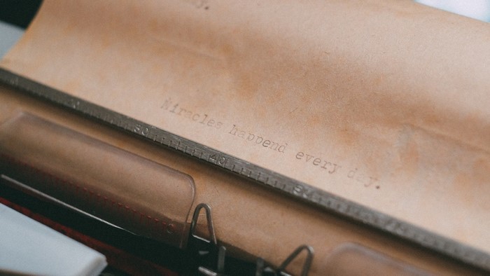 Vintage typewriter with quote on paper