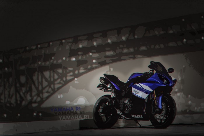 Blue Yamaha R1 motorcycle parked under a bridge